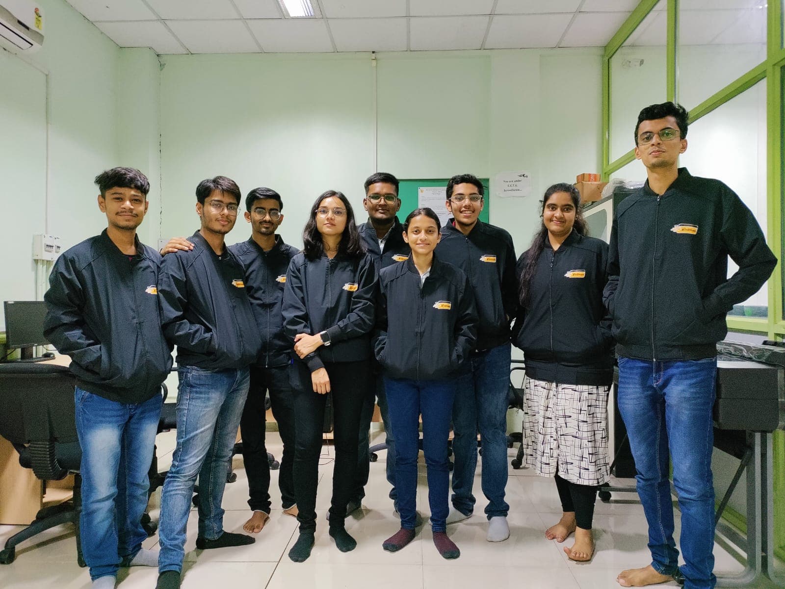 InDhanPay team group photo in branded jackets
